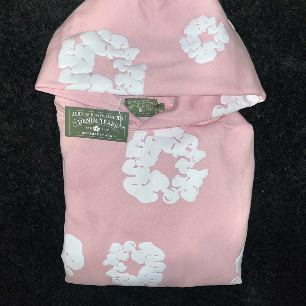 Denim Tears Pink Hoodie with White Floral Design